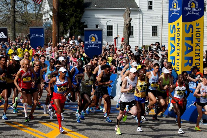 The elite men's runners leave the starting line for the 121st running of the Boston Marathon in Hopkinton